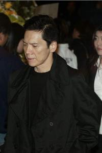 最有名的角色当属《赌神》系列中不苟言笑的\